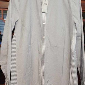 Fits on the shoulder and skims the body with a slightly shaped waist.